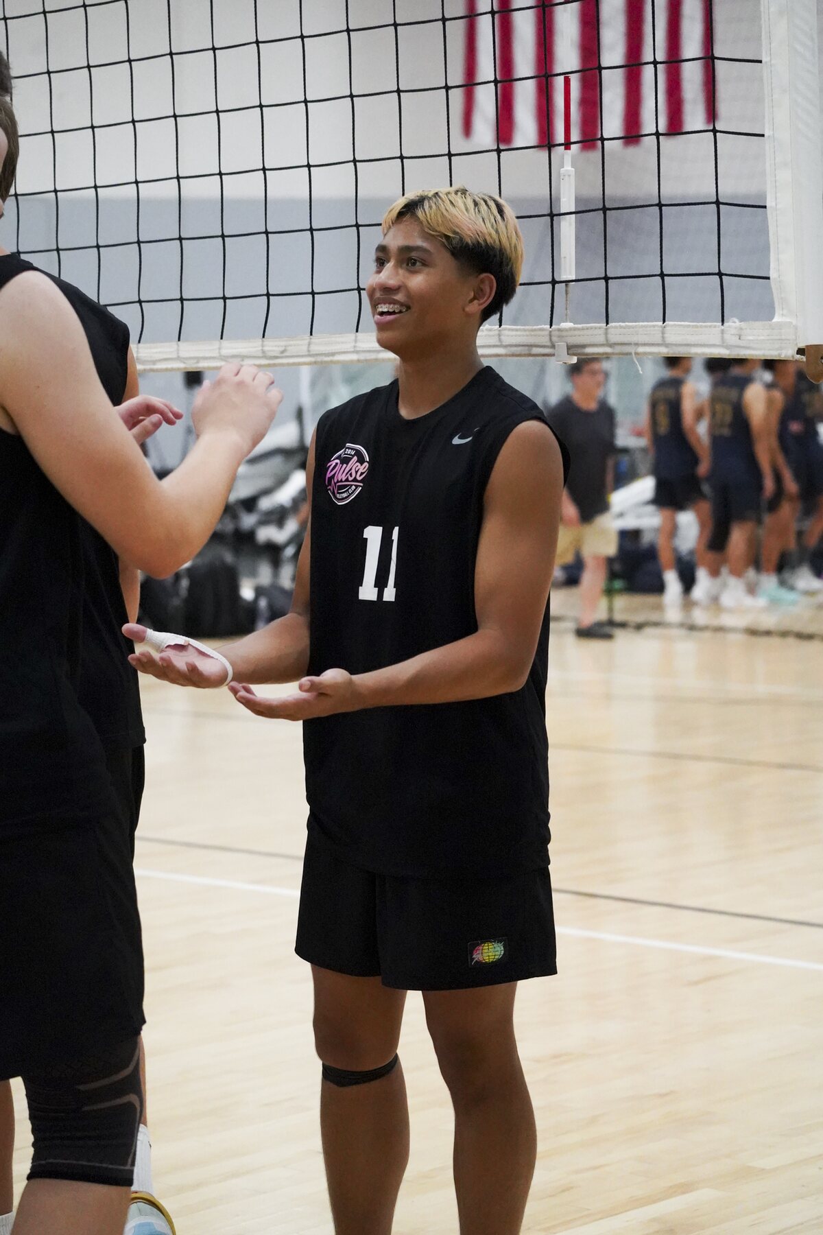 Josh smiling with a teammate